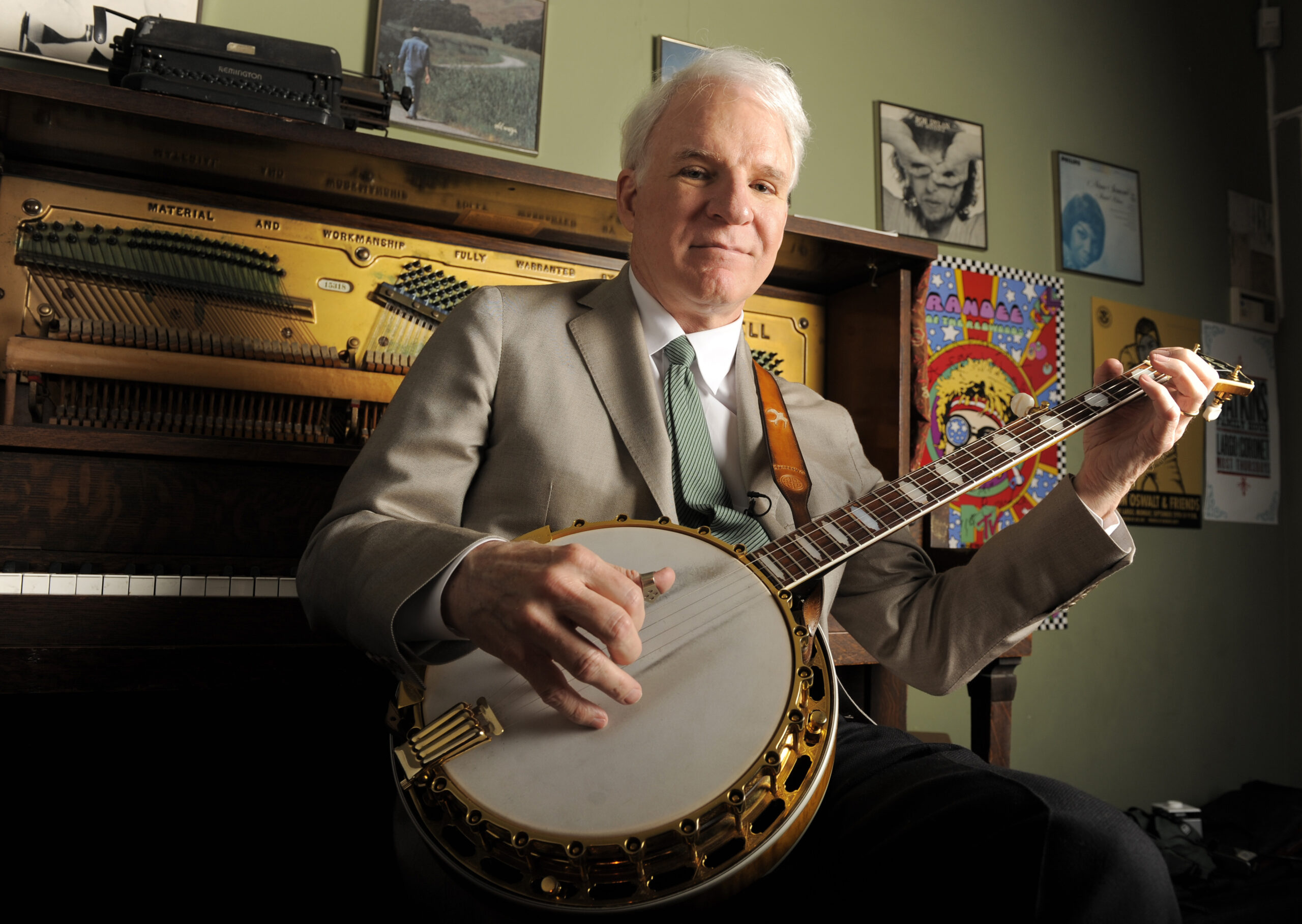 Actor, musician and writer Steve Martin practices with his banjo backstage before an appearance with the Steep Canyon Rangers band at Largo at the Coronet Theatre in Los Angeles, Friday, March 19, 2010. (AP Photo/Chris Pizzello)