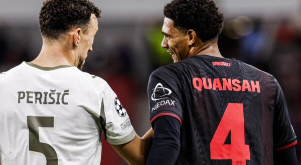 Ivan Perisic of PSV Eindhoven is in discussion with Jarell Quansah of Bayer 04 Leverkusen during the UEFA Champions League 2025/26 League Phase MD2 match between Bayer 04 Leverkusen and PSV Eindhoven at BayArena on October 1, 2025 in Leverkusen, Germany. (Photo by Marcel ter Bals/DeFodi Images)  Photo: Marcel ter Bals/DeFodi Images/DEFODI