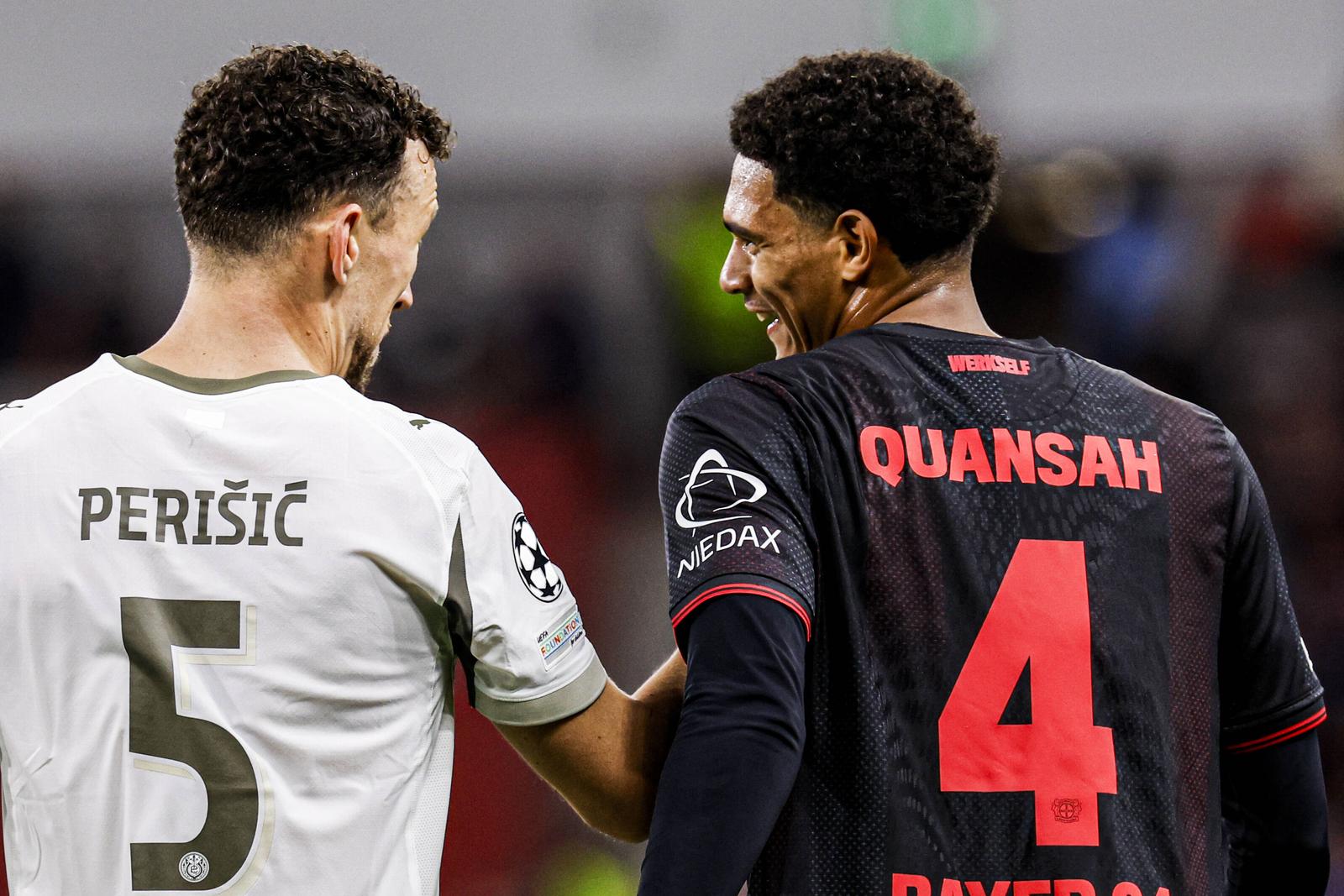 Ivan Perisic of PSV Eindhoven is in discussion with Jarell Quansah of Bayer 04 Leverkusen during the UEFA Champions League 2025/26 League Phase MD2 match between Bayer 04 Leverkusen and PSV Eindhoven at BayArena on October 1, 2025 in Leverkusen, Germany. (Photo by Marcel ter Bals/DeFodi Images)  Photo: Marcel ter Bals/DeFodi Images/DEFODI