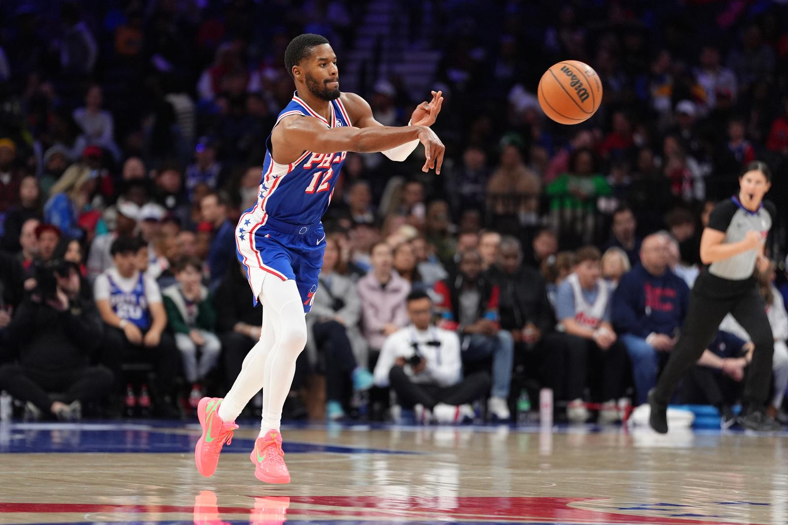 Apr 13, 2025; Philadelphia, Pennsylvania, USA; Philadelphia 76ers guard Jared Butler (12) passes the ball against the Chicago Bulls in the second quarter at Wells Fargo Center. Mandatory Credit: Kyle Ross-Imagn Images/Sipa USA Photo: Imagn Images/SIPA USA