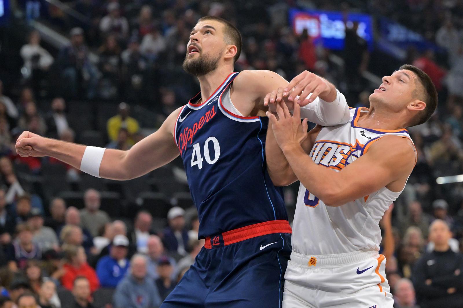 Oct 24, 2025; Inglewood, California, USA; Los Angeles Clippers center Ivica Zubac (40) boxes out Phoenix Suns guard Grayson Allen (8) under the basket in the first half at Intuit Dome. Mandatory Credit: Jayne Kamin-Oncea-Imagn Images/Sipa USA Photo: Imagn Images/SIPA USA