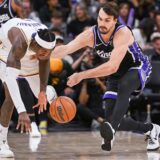 Oct 26, 2025; Sacramento, California, USA; Los Angeles Lakers forward Jarred Vanderbilt (2) and Sacramento Kings forward Dario Saric (20) fight for possession of the ball during the fourth quarter at Golden 1 Center. Mandatory Credit: Ed Szczepanski-Imagn Images/Sipa USA Photo: Imagn Images/SIPA USA
