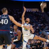Oct 28, 2025; San Francisco, California, USA; Golden State Warriors guard Stephen Curry (30) shoots the basketball against LA Clippers guard Kris Dunn (8) and LA Clippers center Ivica Zubac (40) during the fourth quarter at Chase Center. Mandatory Credit: Neville E. Guard-Imagn Images/Sipa USA Photo: Imagn Images/SIPA USA