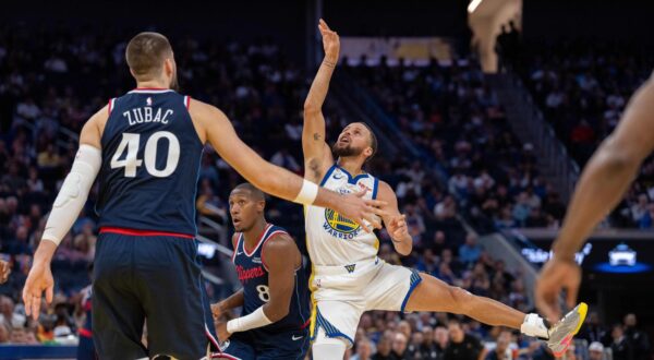 Oct 28, 2025; San Francisco, California, USA; Golden State Warriors guard Stephen Curry (30) shoots the basketball against LA Clippers guard Kris Dunn (8) and LA Clippers center Ivica Zubac (40) during the fourth quarter at Chase Center. Mandatory Credit: Neville E. Guard-Imagn Images/Sipa USA Photo: Imagn Images/SIPA USA