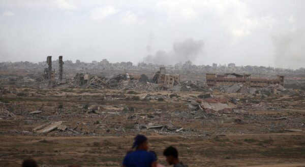 Palestinians observe widespread destruction as smoke rises billows following Israeli bombardment on the Gaza Strip as seen from northwest of Nuseirat refugee camp in Gaza, on Thursday on October 9, 2025. On the same day, Israel and Hamas reached a deal to release the remaining living hostagesa major step toward ending a war that has claimed tens of thousands of lives and triggered a humanitarian catastrophe. Photo by Hassan Al-Jadi/UPI Photo via Newscom Photo: Hassan Al-Jadi/NEWSCOM
