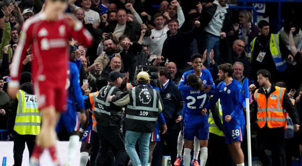 Chelsea's Estevao (top rear) celebrates after scoring his sides second goal during the Premier League match at Stamford Bridge, London. Picture date: Saturday October 4, 2025. Photo: Adam Davy/PRESS ASSOCIATION