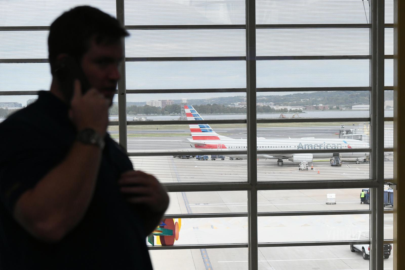 (251011) -- ARLINGTON, Oct. 11, 2025 (Xinhua) -- A man makes a phone call at Ronald Reagan Washington National Airport in Arlington, Virginia, the United States, on Oct. 10, 2025. The U.S. federal government shutdown has led to flight delays, as essential employees such as air traffic controllers and Transportation Security Administration (TSA) officers are working without pay. That has led to staff shortages. (Xinhua/Li Rui) Photo: Li Rui/XINHUA
