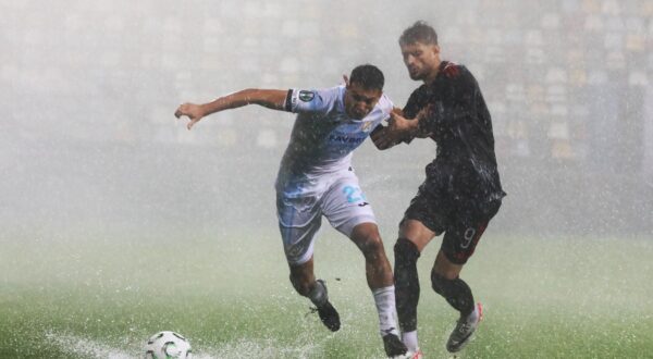 (251024) -- RIJEKA, Oct. 24, 2025 (Xinhua) -- Ante Orec (L) of HNK Rijeka vies with Albion Rrahmani of Sparta Praha during the UEFA Conference League group phase match between HNK Rijeka and AC Sparta Praha on Oct. 23, 2025 in Rijeka, Croatia. The match is postponed due to heavy rain. (Photo by Goran Kovacic/PIXSELL via Xinhua) Photo: Li Xuejun/XINHUA
